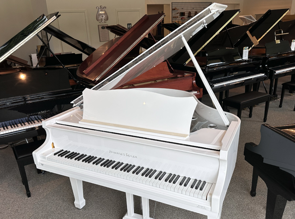 white baby grand piano with nickel cape coral